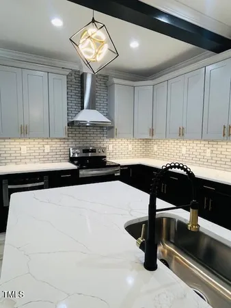 a kitchen with a table and chairs
