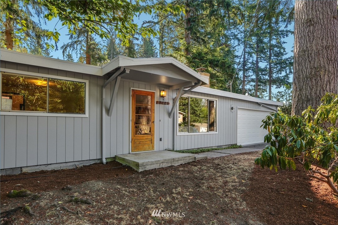 22229 17th Place West Bothell, WA 98021 - Photo 2 of 25 a front view of a house with garden
