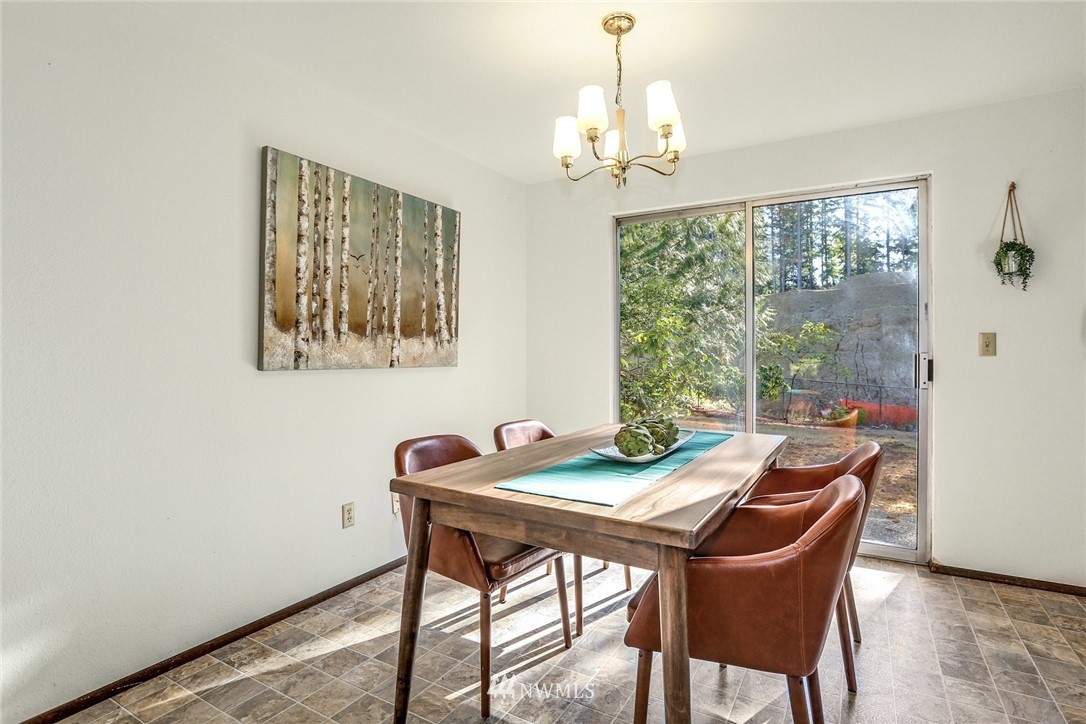 22229 17th Place West Bothell, WA 98021 - Photo 12 of 25 a view of a dining room with furniture window and outside view