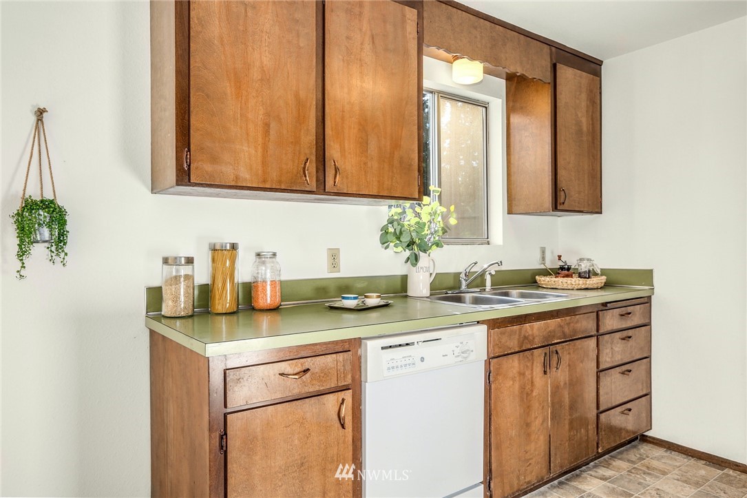 22229 17th Place West Bothell, WA 98021 - Photo 14 of 25 a bathroom with a granite countertop sink and a mirror