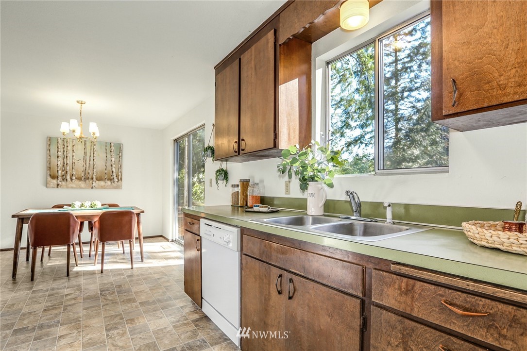 22229 17th Place West Bothell, WA 98021 - Photo 17 of 25 a kitchen with a sink and cabinets