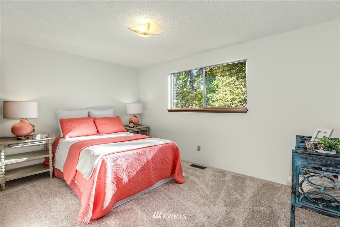 22229 17th Place West Bothell, WA 98021 - Photo 19 of 25 a bedroom with bed and a window