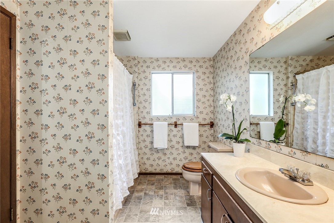 22229 17th Place West Bothell, WA 98021 - Photo 20 of 25 a bathroom with a sink a toilet and shower