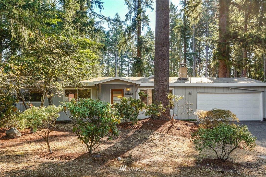 22229 17th Place West Bothell, WA 98021 - Photo 3 of 25 a front view of a house with garden