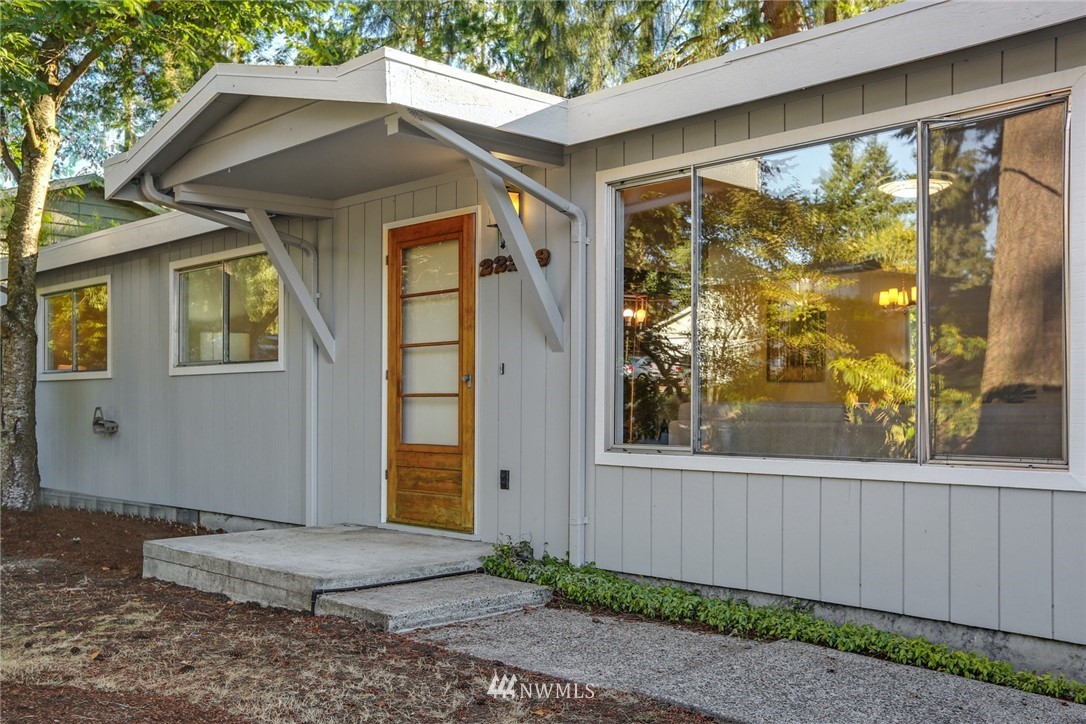 22229 17th Place West Bothell, WA 98021 - Photo 4 of 25 a front view of a house with a yard