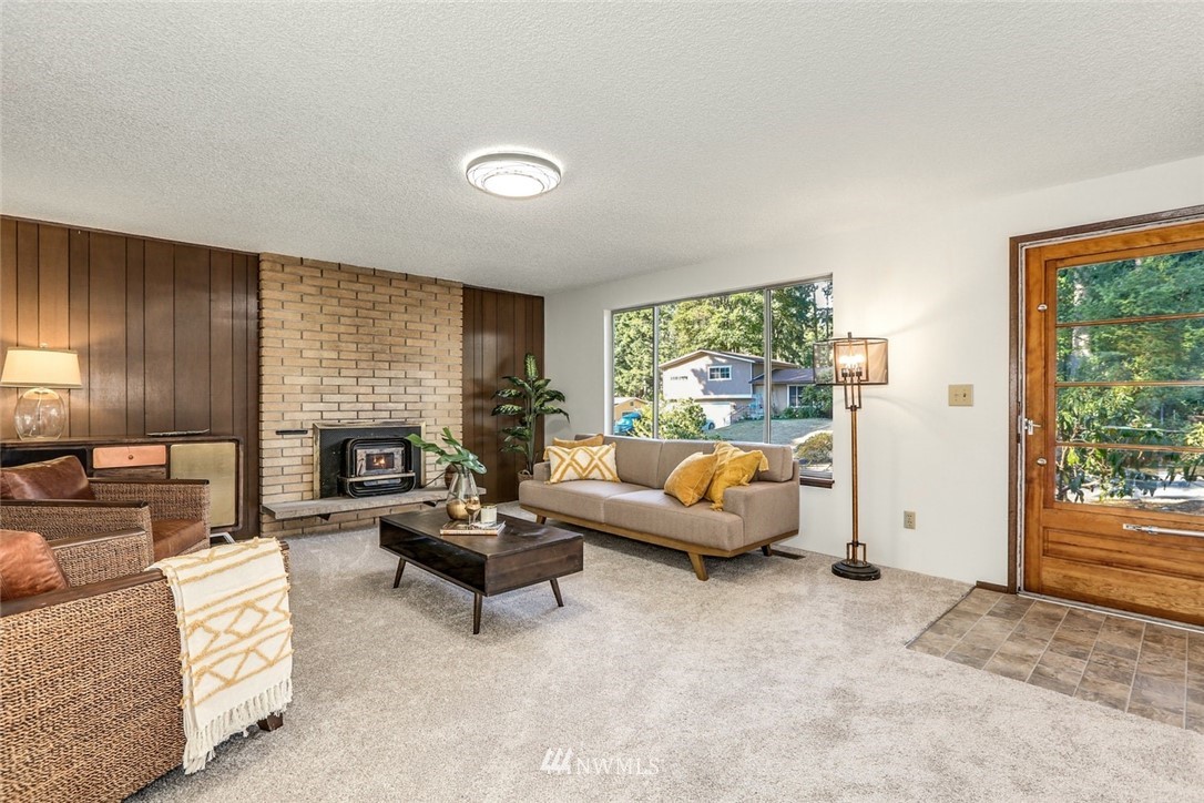 22229 17th Place West Bothell, WA 98021 - Photo 7 of 25 a living room with furniture and a fireplace