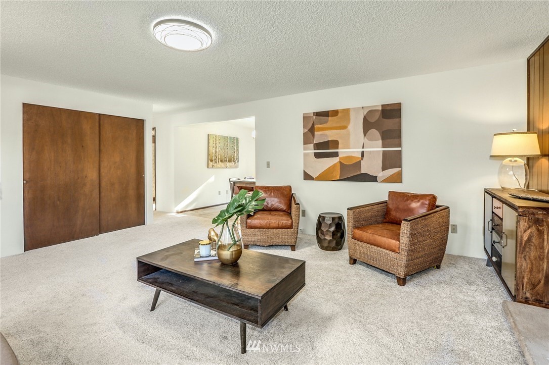22229 17th Place West Bothell, WA 98021 - Photo 9 of 25 a living room with furniture and a table