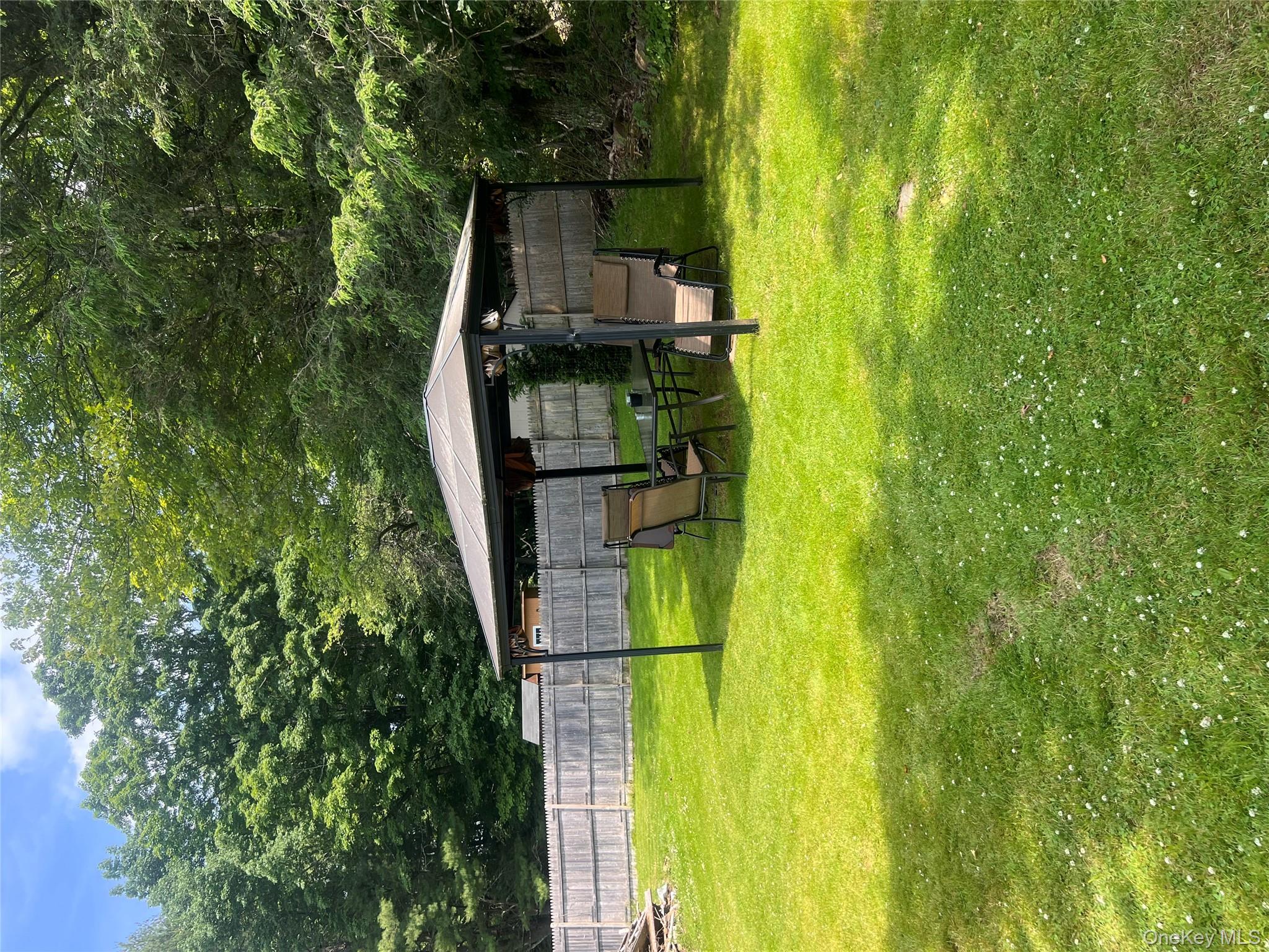279 Cold Spring Road Monticello, NY 12701 - Photo 24 of 32 View of yard with a gazebo and view of scattered trees