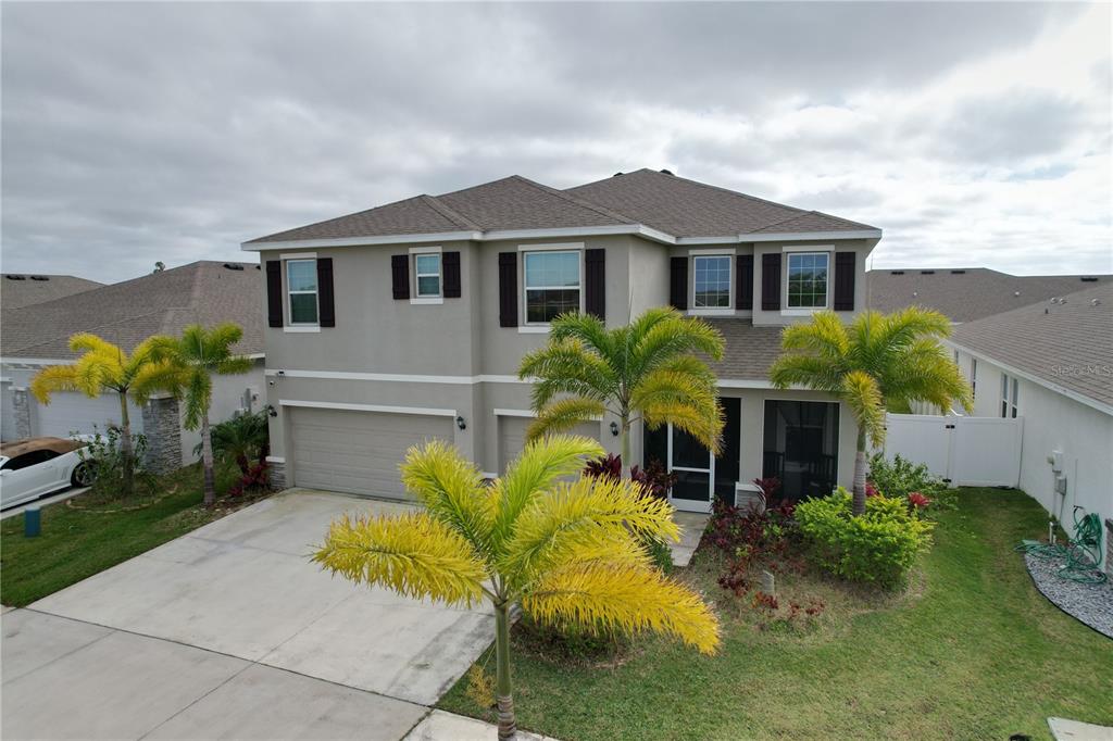 472 6th Avenue Northwest Ruskin, FL 33570 - Photo 2 of 96 a front view of a house with a yard