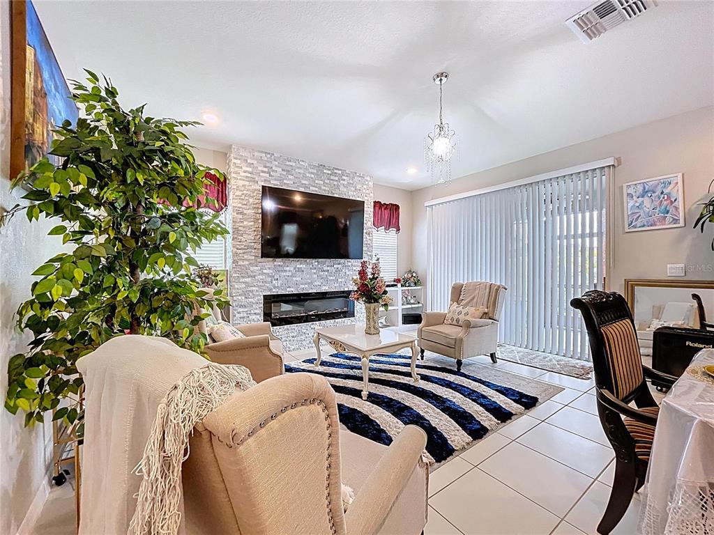 472 6th Avenue Northwest Ruskin, FL 33570 - Photo 28 of 96 a view of a livingroom with furniture and a flat screen tv