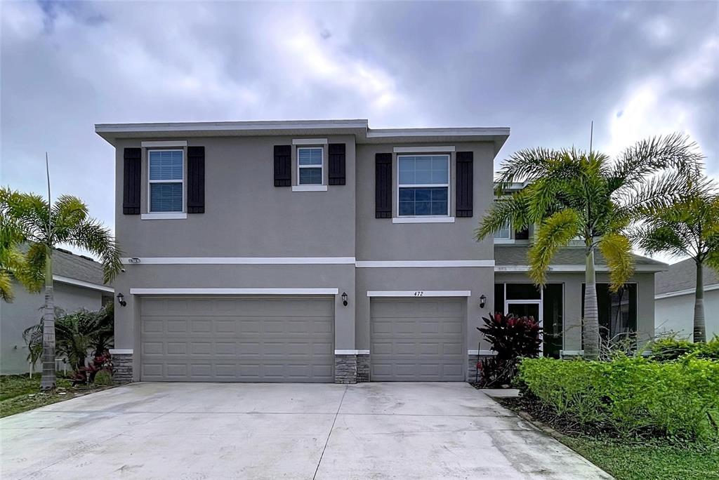 472 6th Avenue Northwest Ruskin, FL 33570 - Photo 3 of 96 front view of house with a yard
