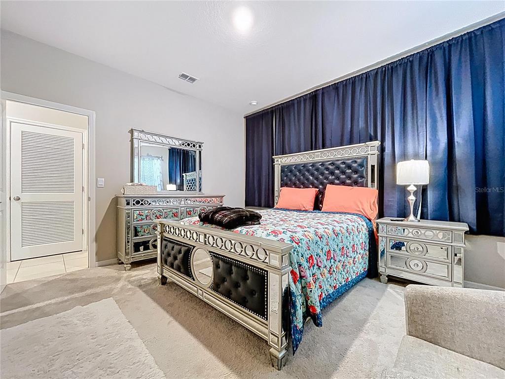 472 6th Avenue Northwest Ruskin, FL 33570 - Photo 34 of 96 a bedroom with a bed and a dresser