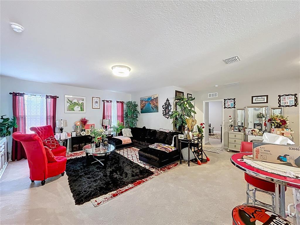 472 6th Avenue Northwest Ruskin, FL 33570 - Photo 41 of 96 a living room with furniture toys and a large window