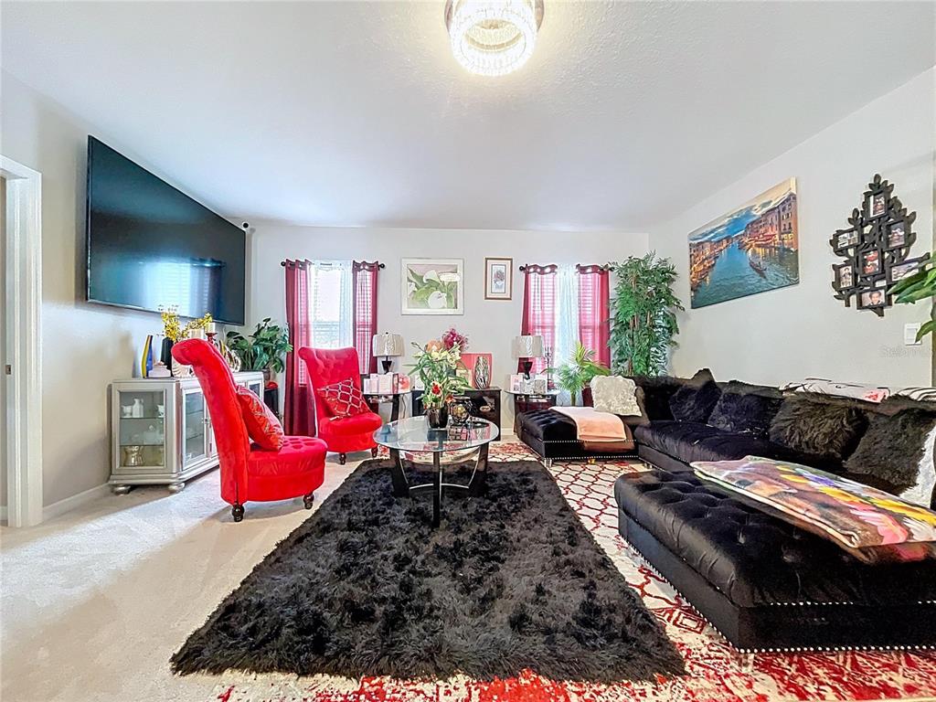 472 6th Avenue Northwest Ruskin, FL 33570 - Photo 42 of 96 a living room with furniture kitchen view and a large window