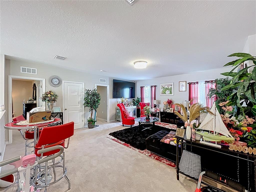 472 6th Avenue Northwest Ruskin, FL 33570 - Photo 43 of 96 a living room with furniture a window and a flat screen tv