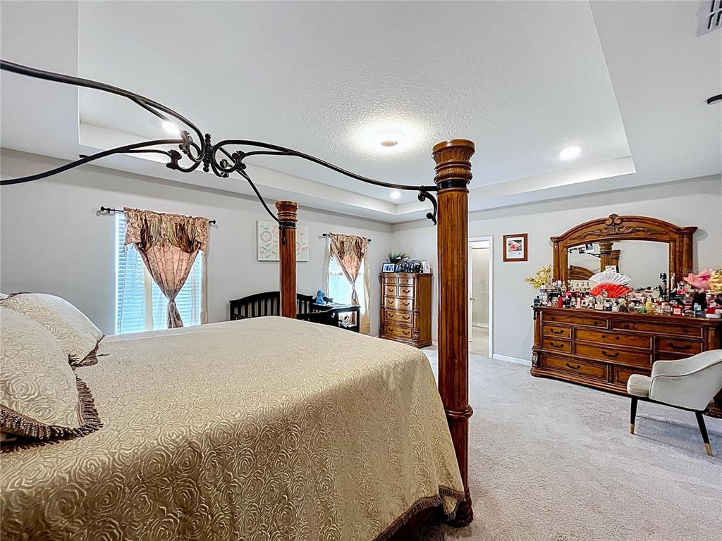 472 6th Avenue Northwest Ruskin, FL 33570 - Photo 47 of 96 a bed room with a bed and dresser