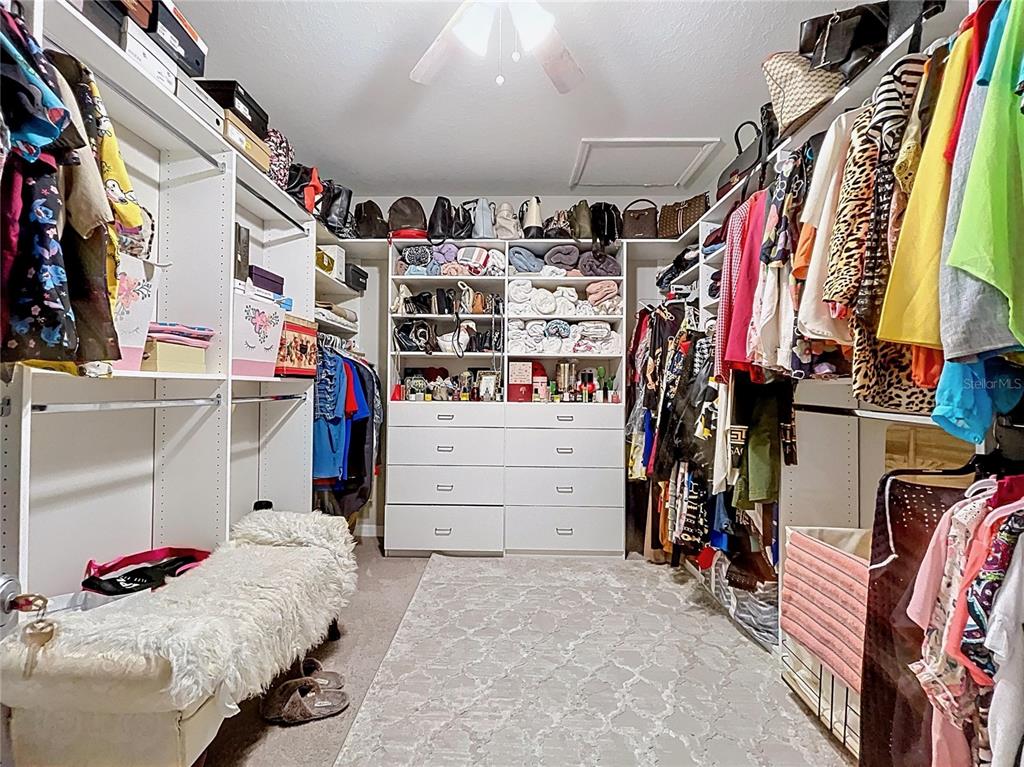 472 6th Avenue Northwest Ruskin, FL 33570 - Photo 57 of 96 a view of walk in closet with clothes and shoes