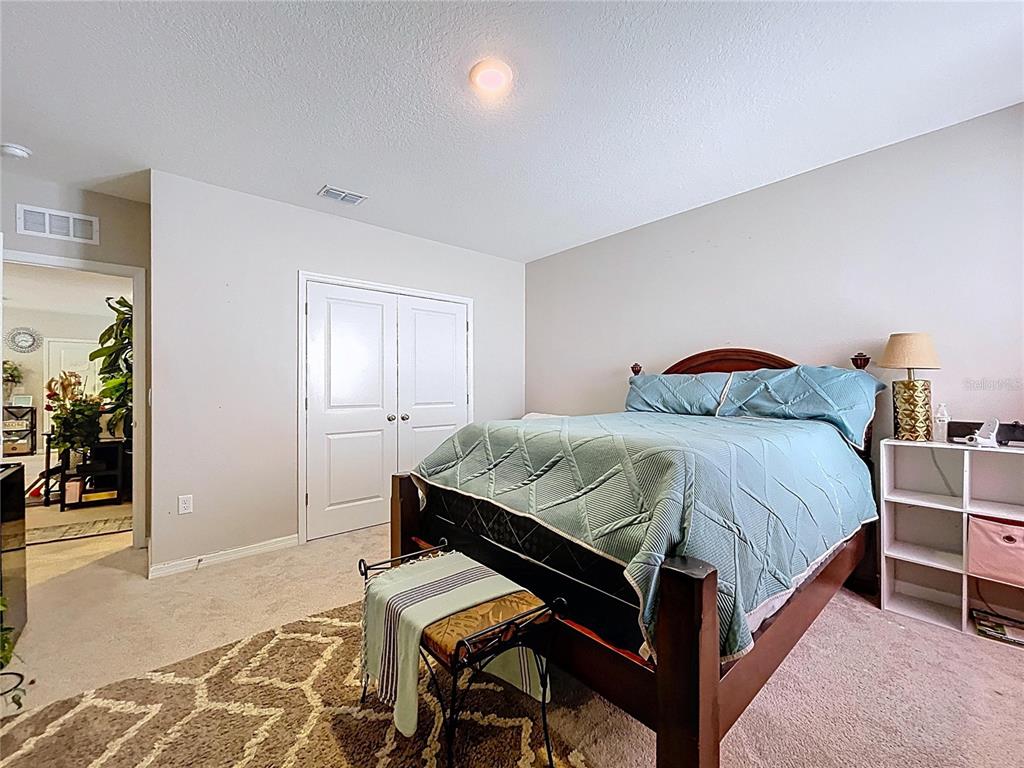 472 6th Avenue Northwest Ruskin, FL 33570 - Photo 60 of 96 a bedroom with a bed and a table in it