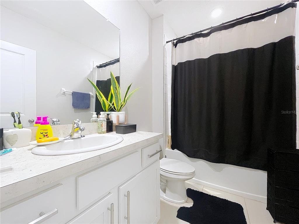 472 6th Avenue Northwest Ruskin, FL 33570 - Photo 61 of 96 a bathroom with a sink vanity mirror and toilet