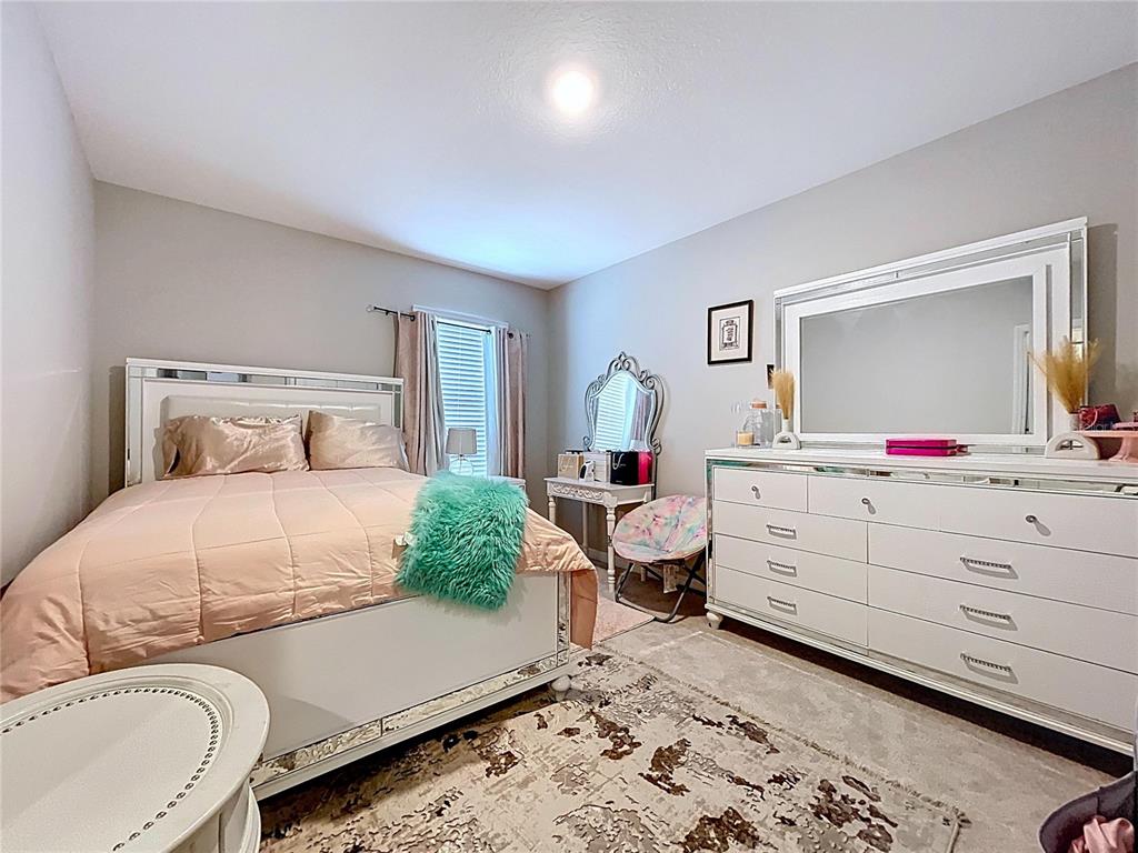 472 6th Avenue Northwest Ruskin, FL 33570 - Photo 63 of 96 a bedroom with a bed and a dresser