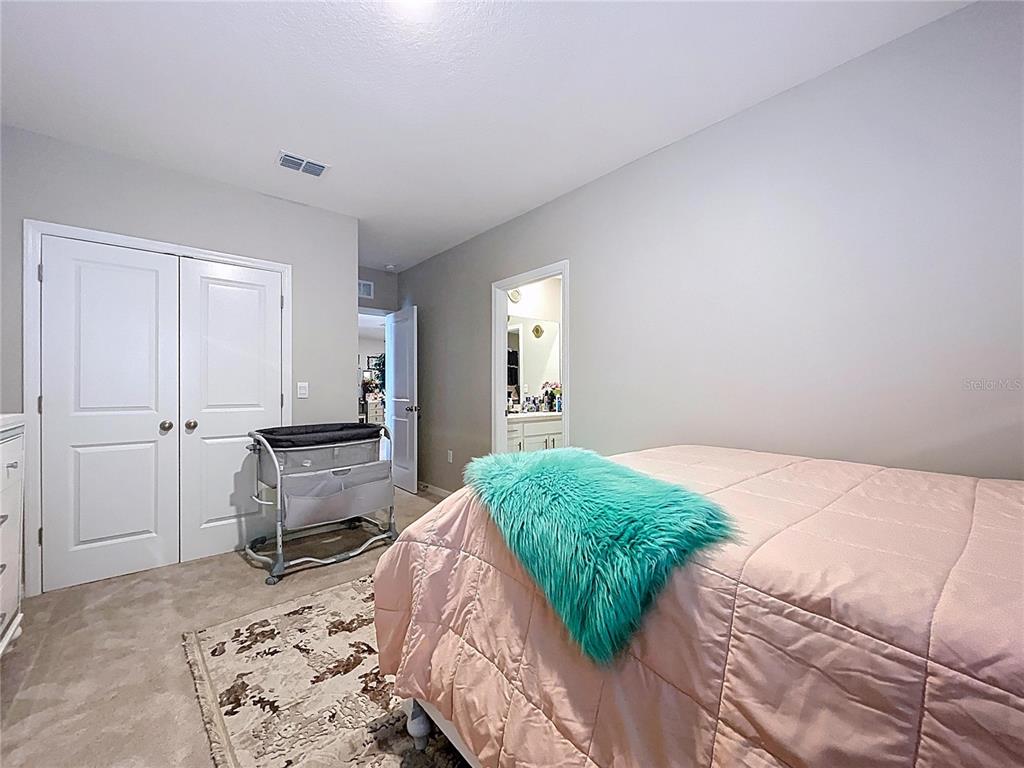 472 6th Avenue Northwest Ruskin, FL 33570 - Photo 64 of 96 a bedroom with a bed and chair