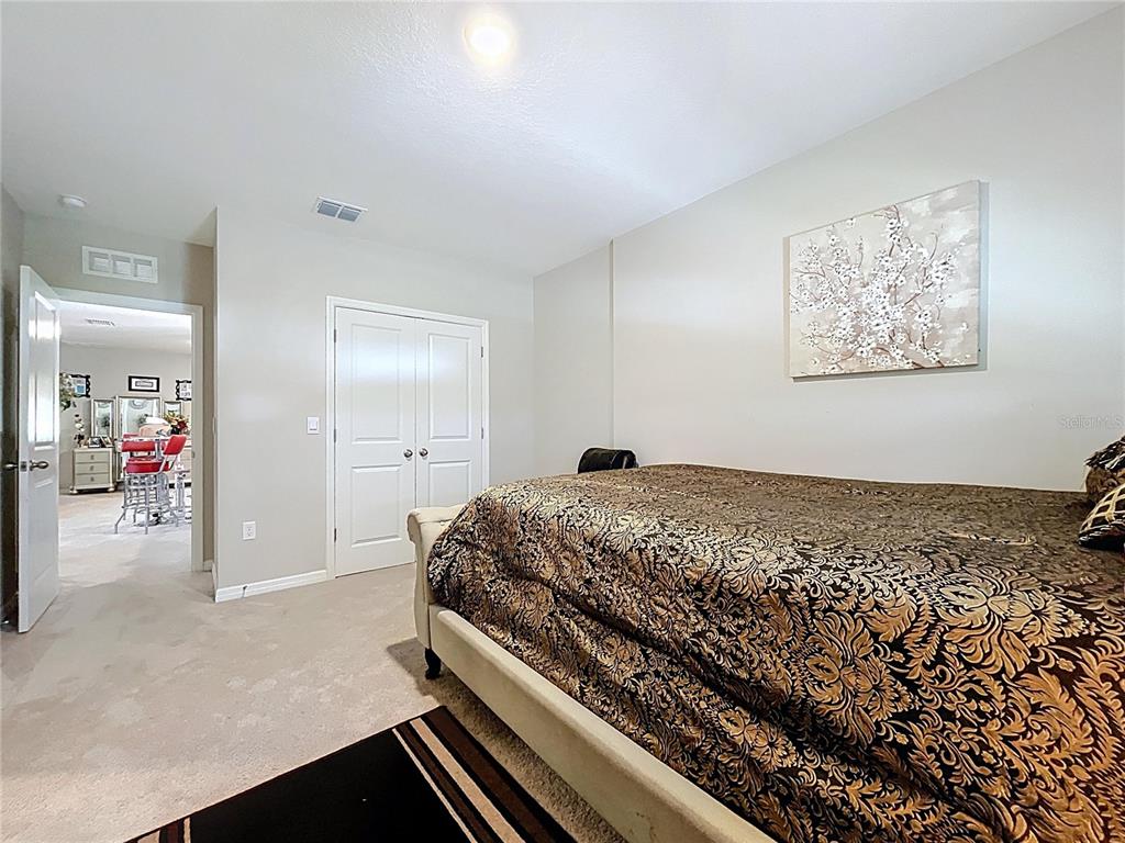 472 6th Avenue Northwest Ruskin, FL 33570 - Photo 66 of 96 a bedroom with a bed and painting on the wall