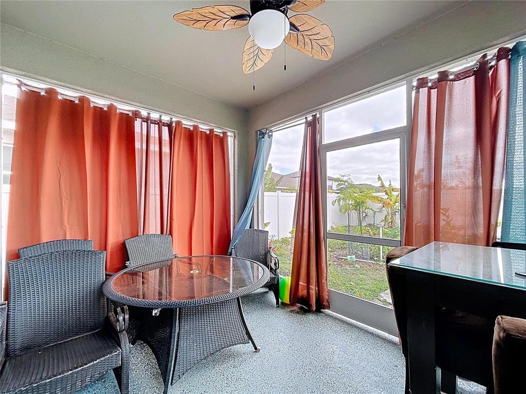 472 6th Avenue Northwest Ruskin, FL 33570 - Photo 71 of 96 a dining room with furniture and a chandelier