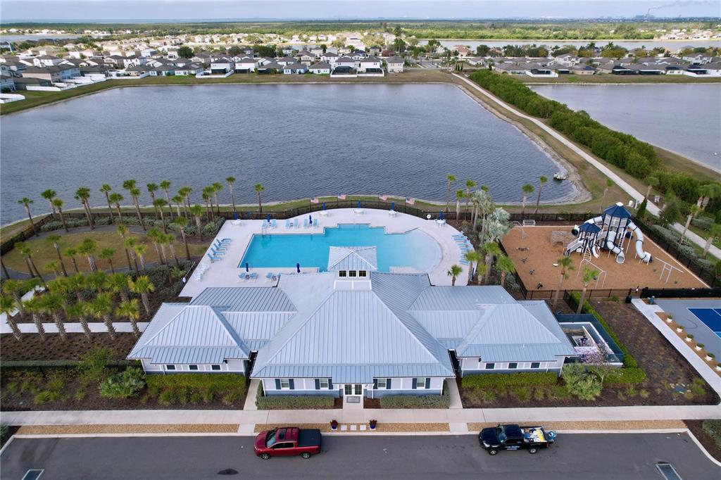 472 6th Avenue Northwest Ruskin, FL 33570 - Photo 87 of 96 an aerial view of a house with a garden and lake view