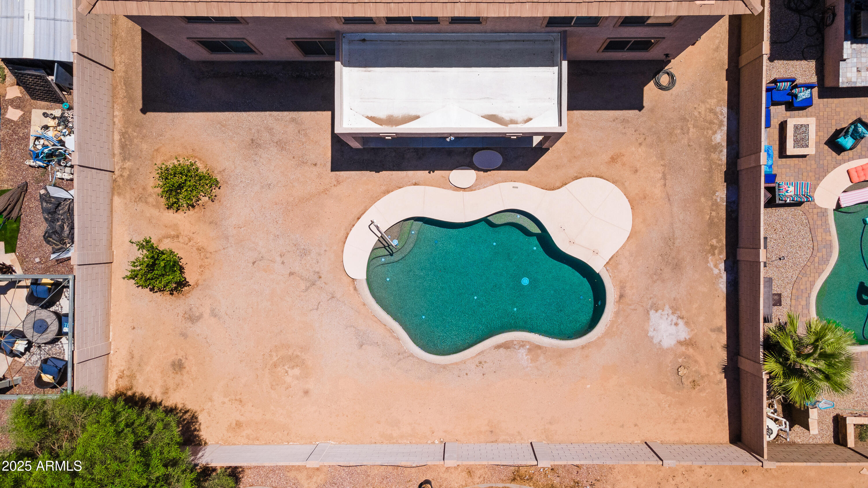 13580 West Boca Raton Road Surprise, AZ 85379 - Photo 52 of 73 an aerial view of a house with a swimming pool and garden