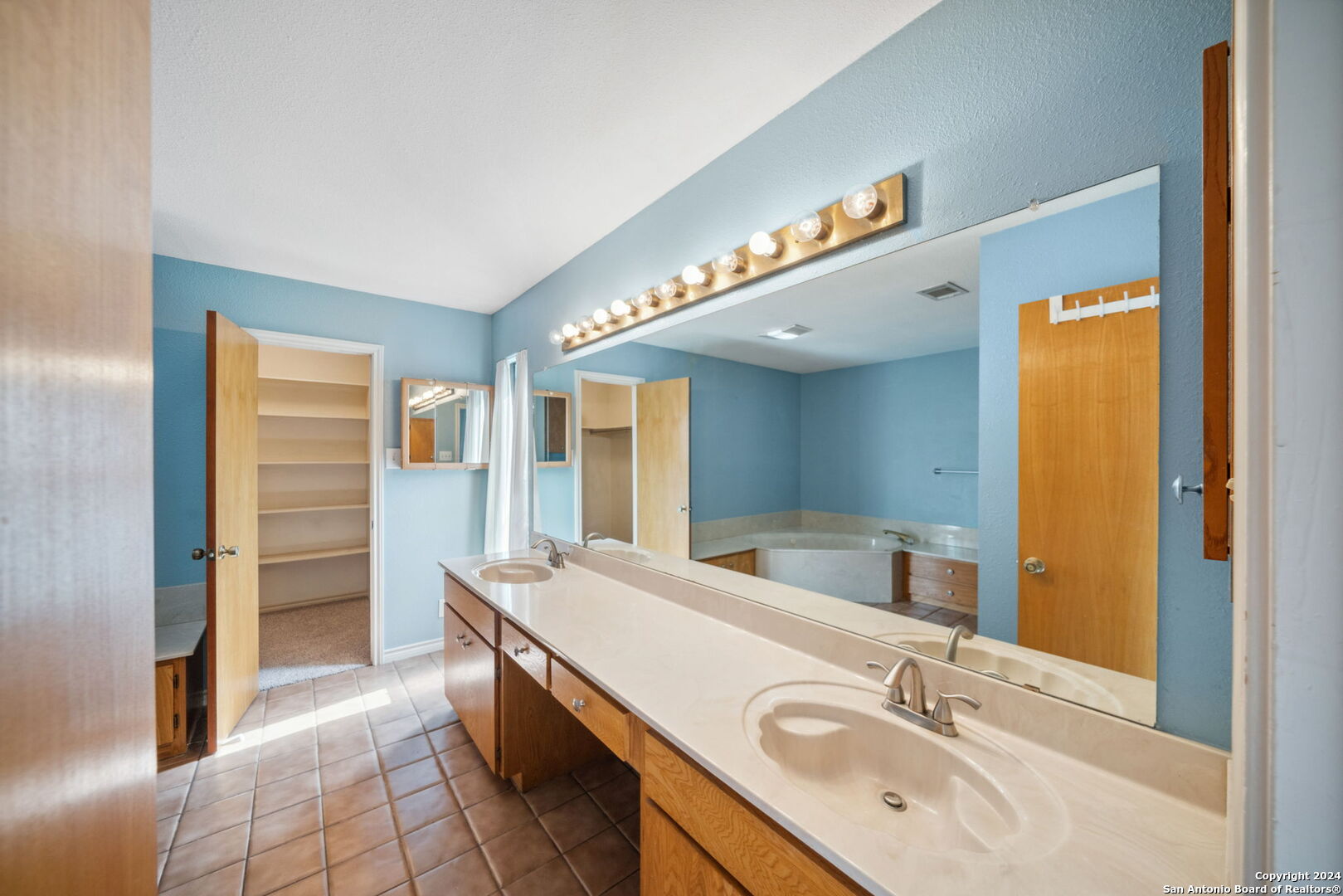 116 Bobwhite Trail Seguin, TX 78155 - Photo 12 of 23 a bathroom with a sink and a mirror