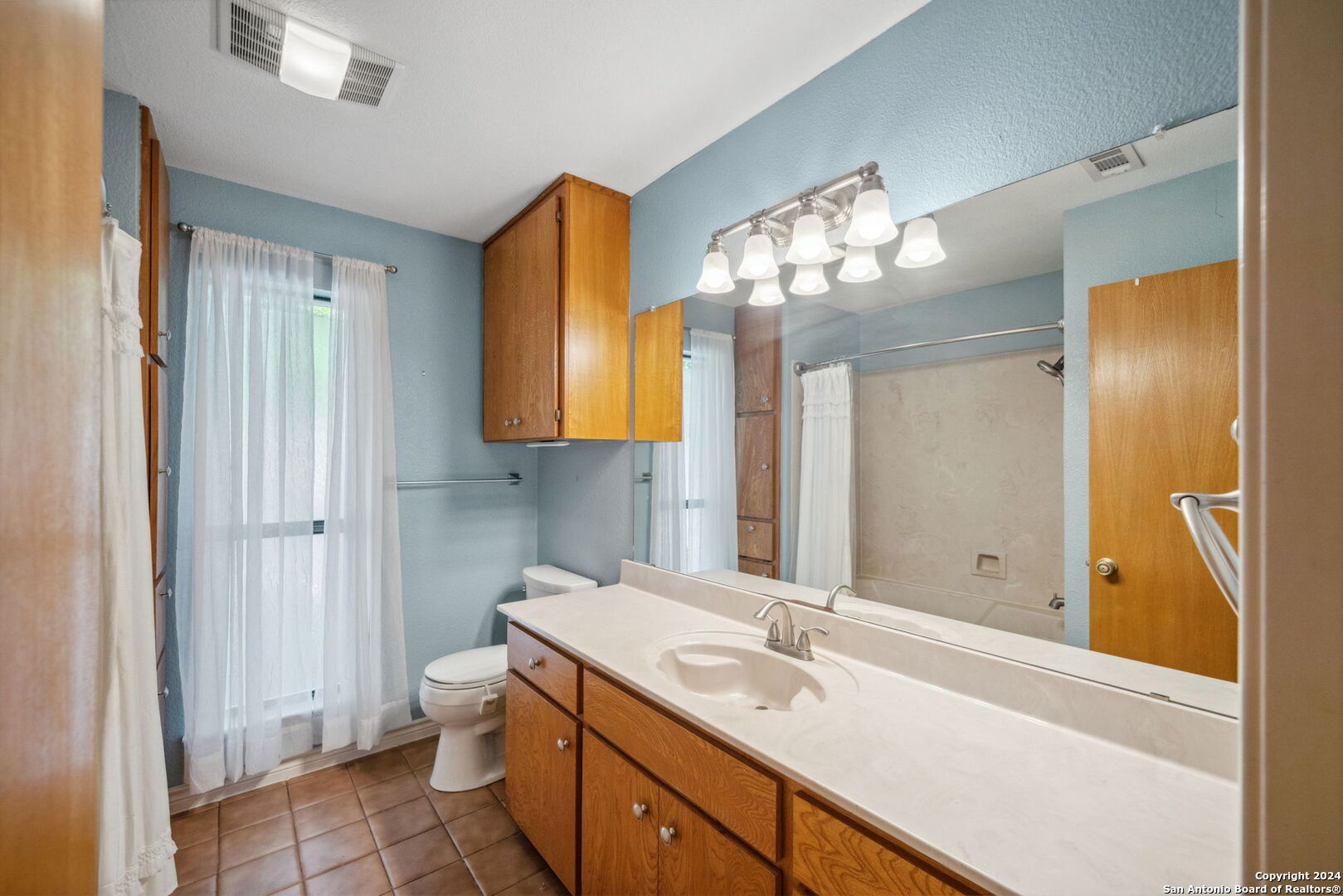 116 Bobwhite Trail Seguin, TX 78155 - Photo 14 of 23 a bathroom with a double vanity sink and a mirror