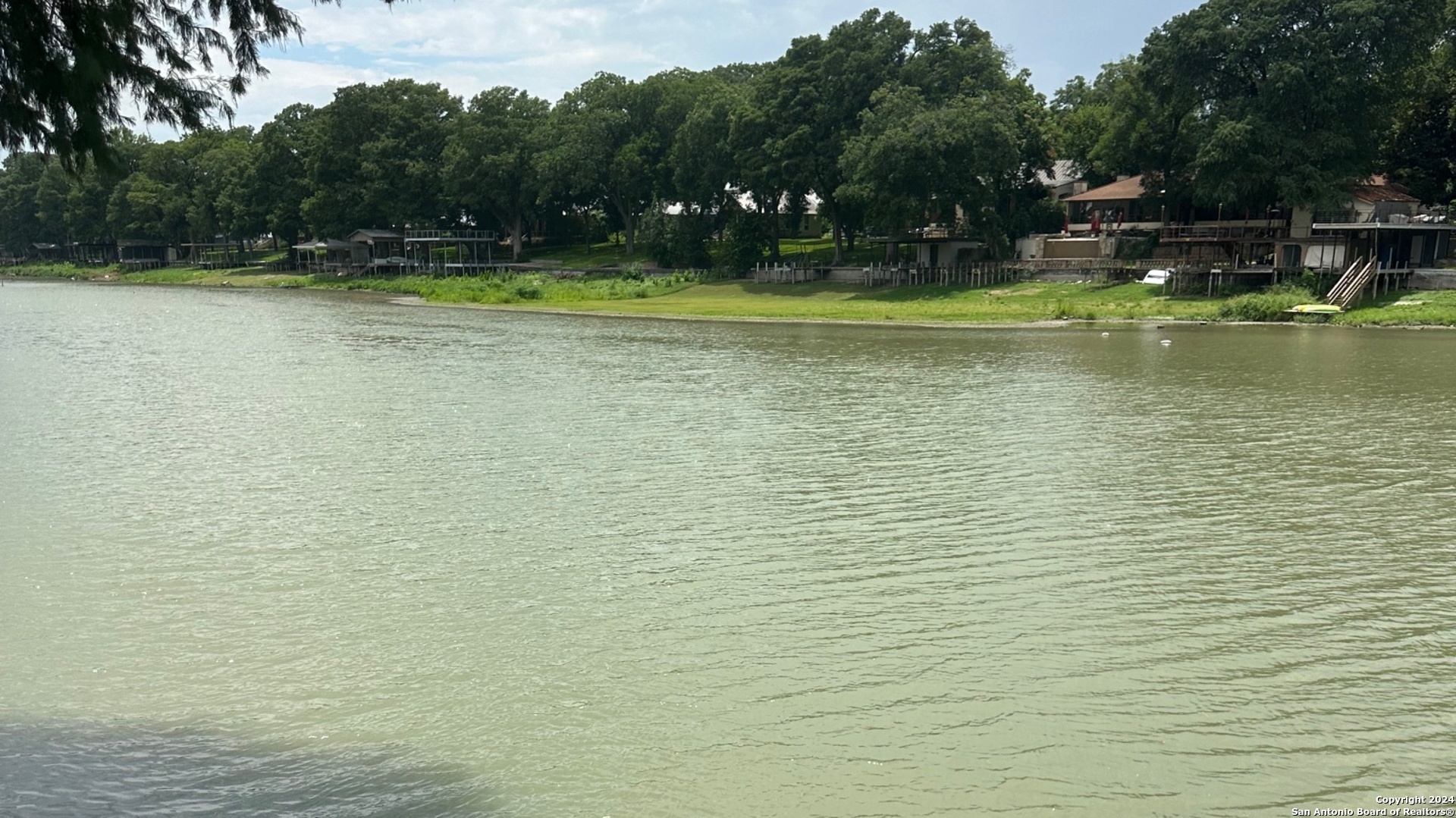 116 Bobwhite Trail Seguin, TX 78155 - Photo 23 of 23 a view of a swimming pool and trees in the background