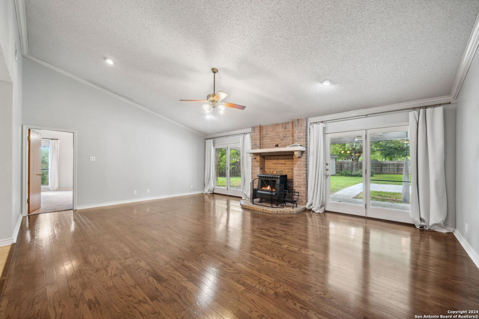 116 Bobwhite Trail Seguin, TX 78155 - Photo 5 of 23 a view of an empty room with window and wooden floor