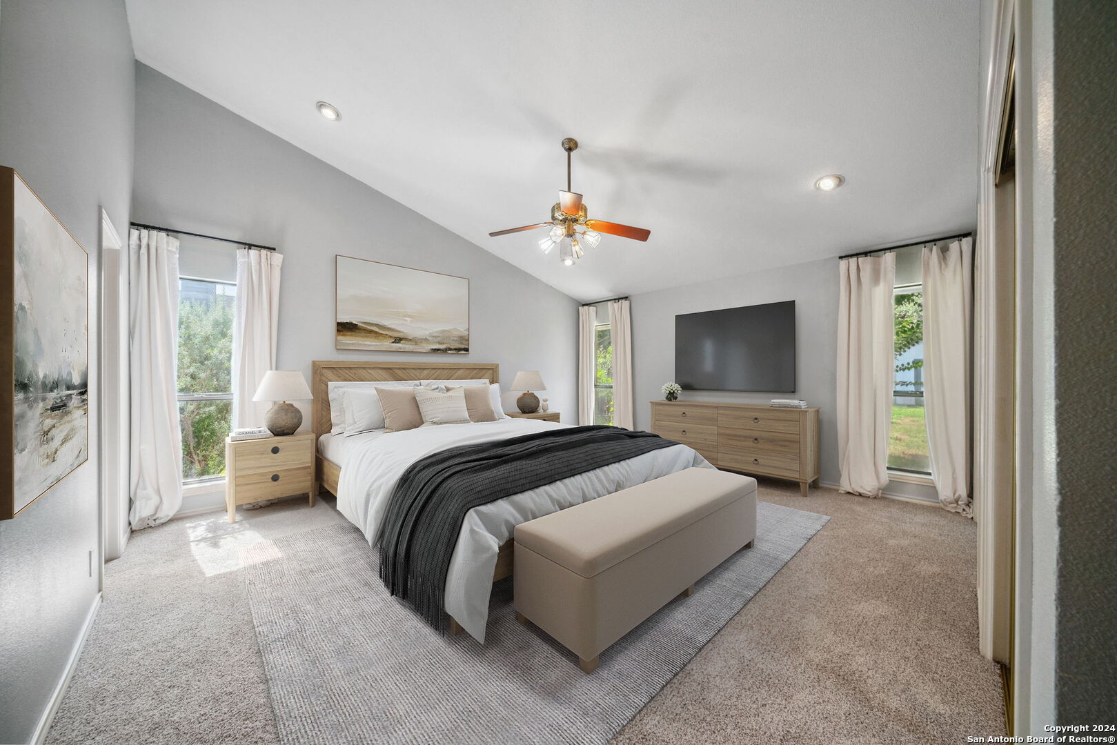 116 Bobwhite Trail Seguin, TX 78155 - Photo 10 of 23 a bedroom with a large bed and a chandelier