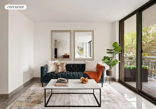 a living room with furniture and a potted plant