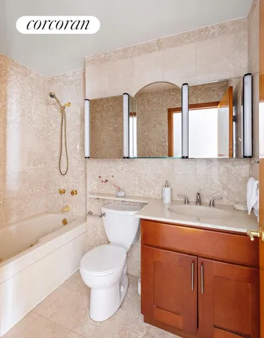 a bathroom with a sink a toilet and a bathtub