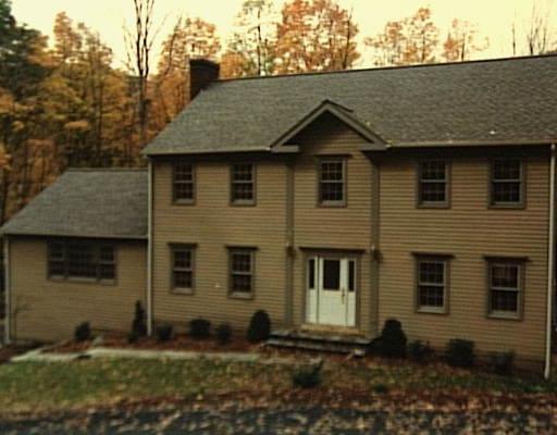 3 New Road Ridgefield, CT 06877 - Photo 1 of 1 a front view of a house with a yard