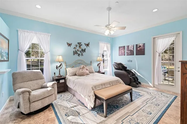 a bedroom with furniture and a chandelier