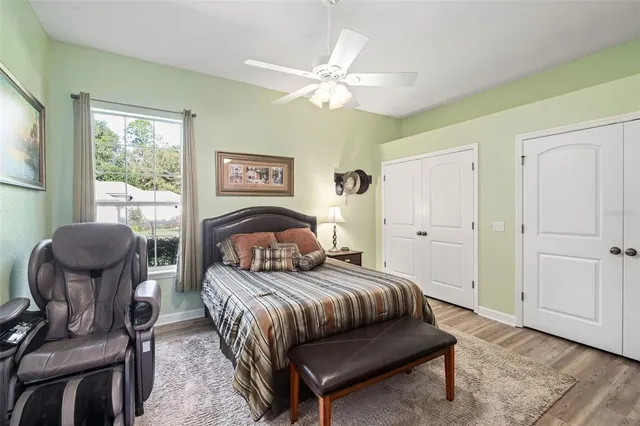 a bedroom with a bed and a chair