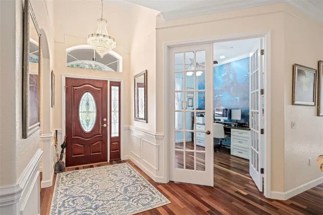 a view of an entryway with a chandelier