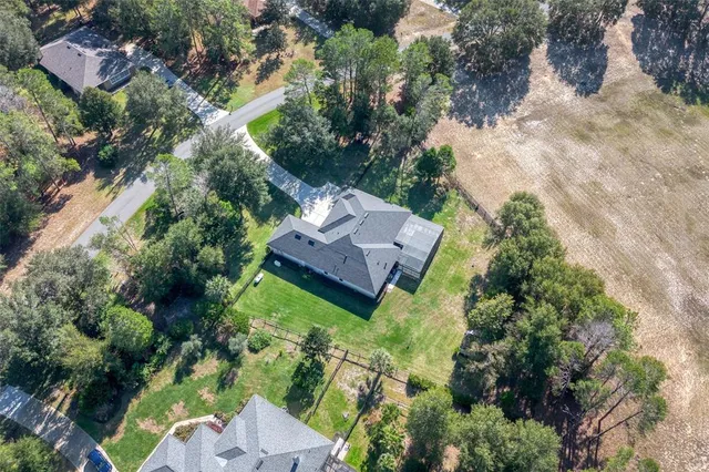 an aerial view of house with yard