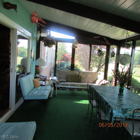 3901 Industry Road Rootstown, OH 44272 - Photo 12 of 22 The sunroom is off of the family room. A quiet spot to read, reflect and enjoy.