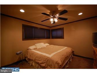 11 St Dunstans Road Hatboro, PA 19040 - Photo 7 of 12 a bedroom with a bed and a chandelier