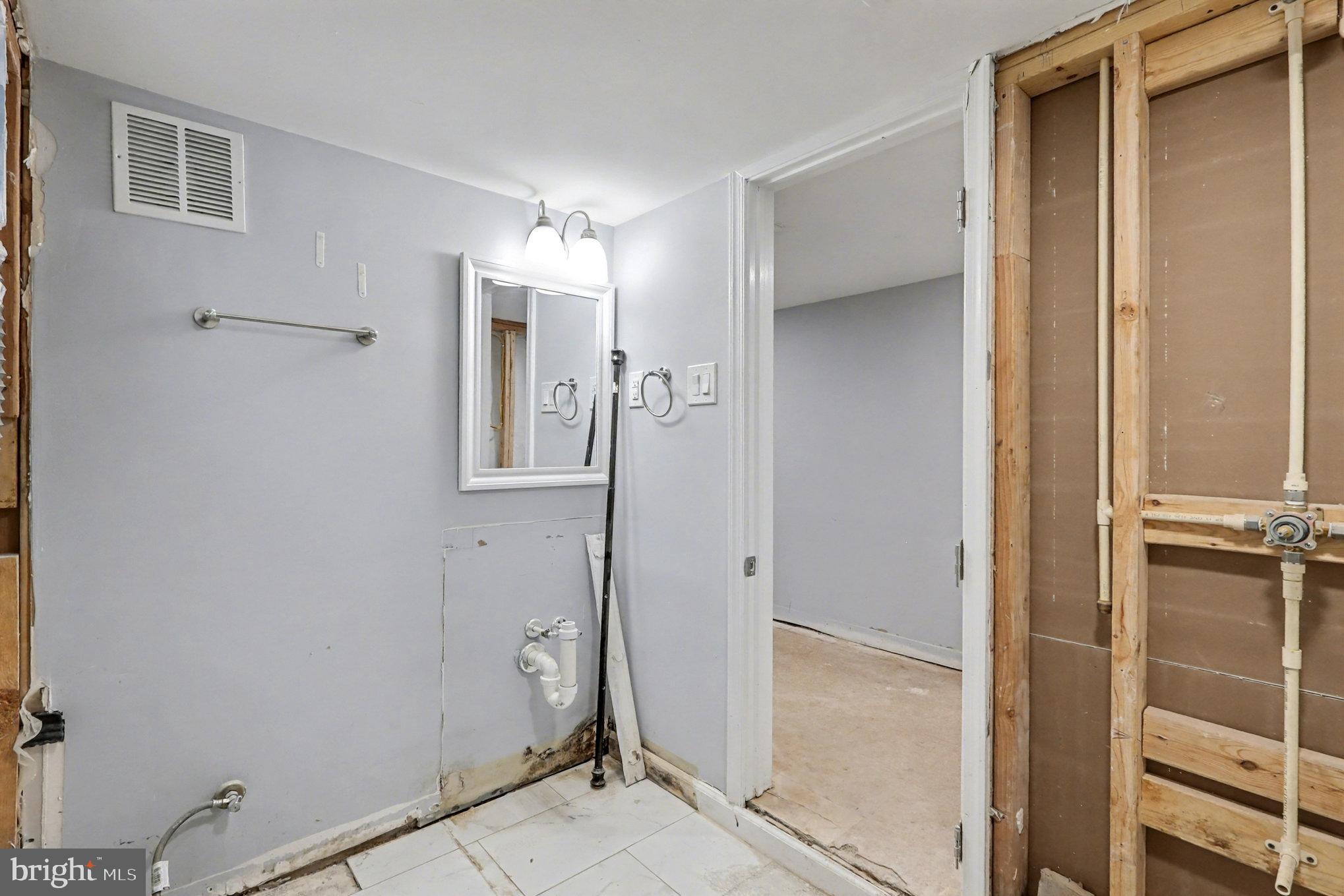 5406 Taylor Road Hyattsville, MD 20781 - Photo 17 of 26 a view of a hallway with closet and wooden floor