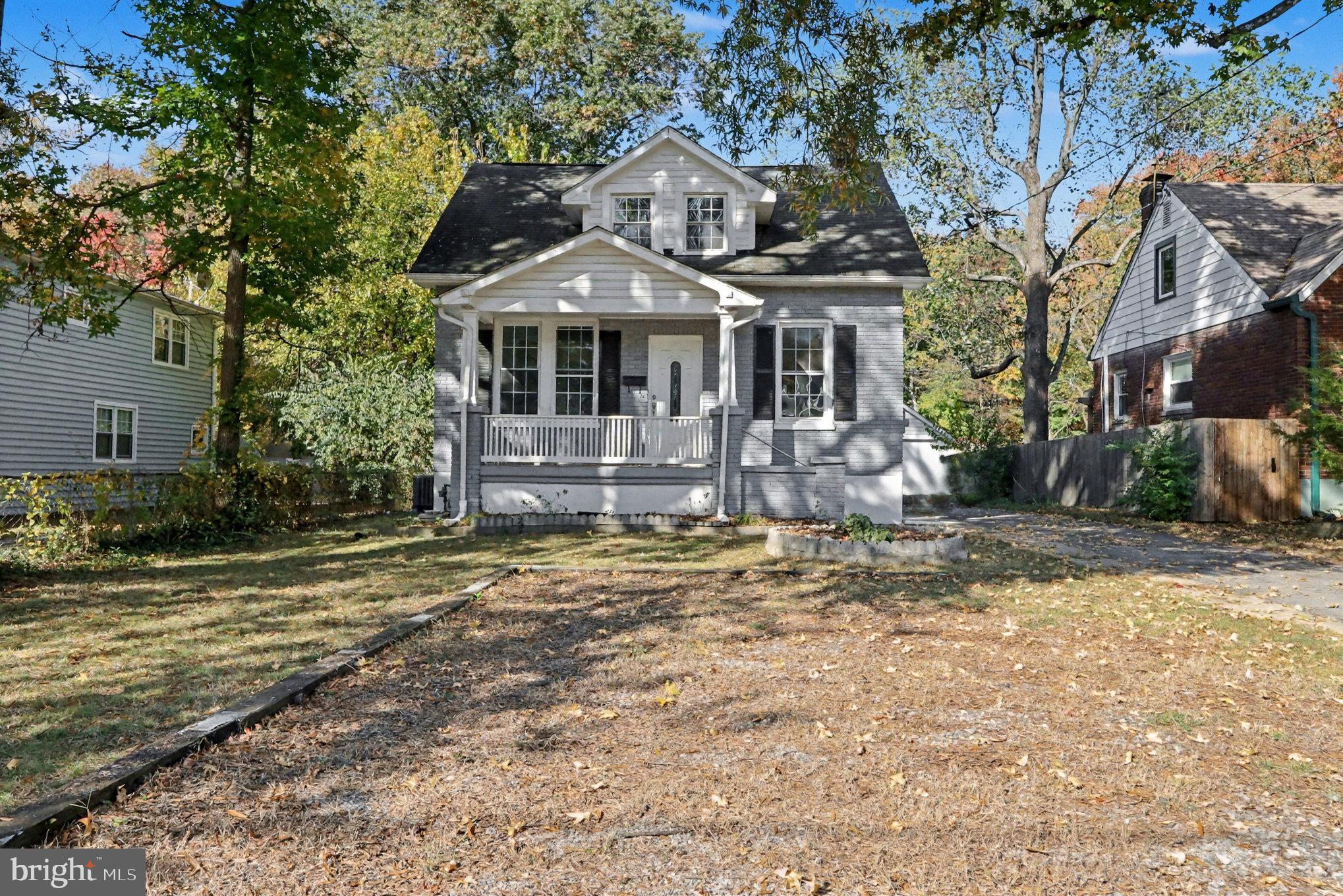 5406 Taylor Road Hyattsville, MD 20781 - Photo 2 of 26 a front view of a house with a yard