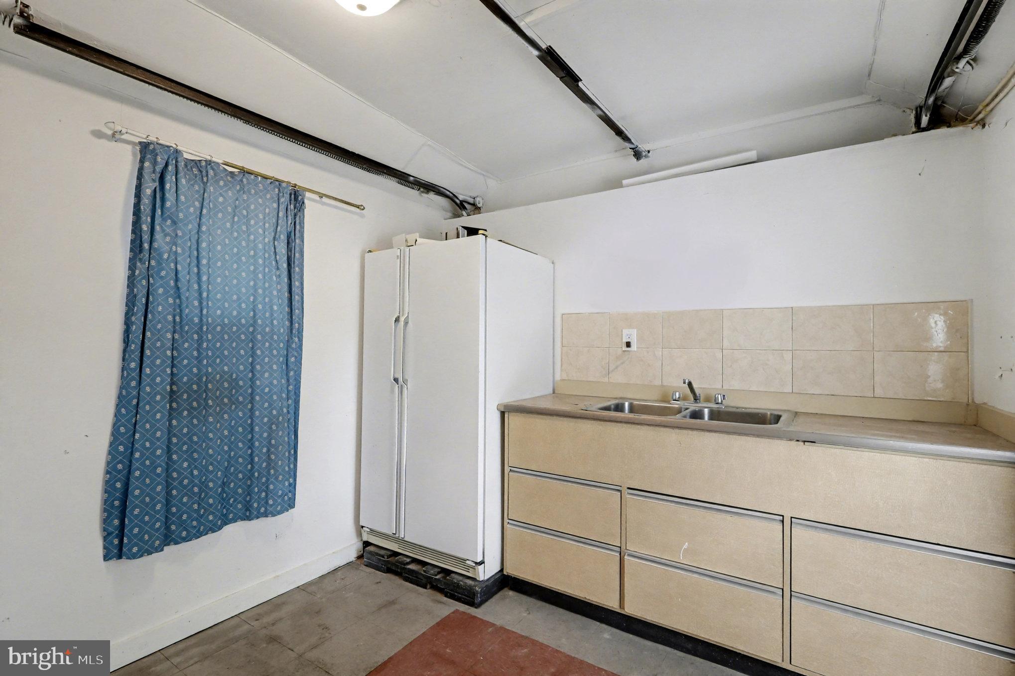 5406 Taylor Road Hyattsville, MD 20781 - Photo 22 of 26 a bathroom with a granite countertop sink and shower
