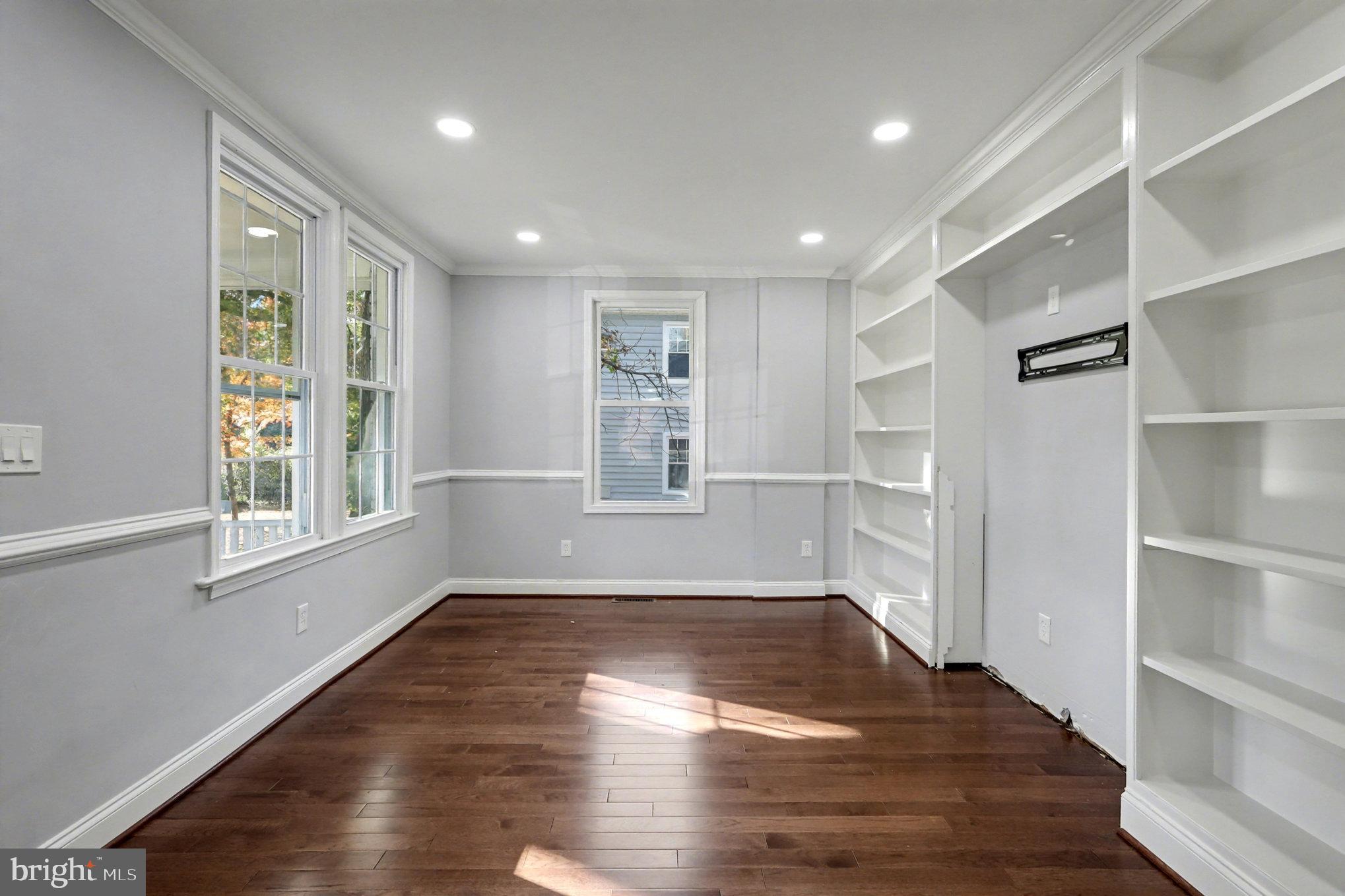 5406 Taylor Road Hyattsville, MD 20781 - Photo 5 of 26 a view of empty room with wooden floor and fan
