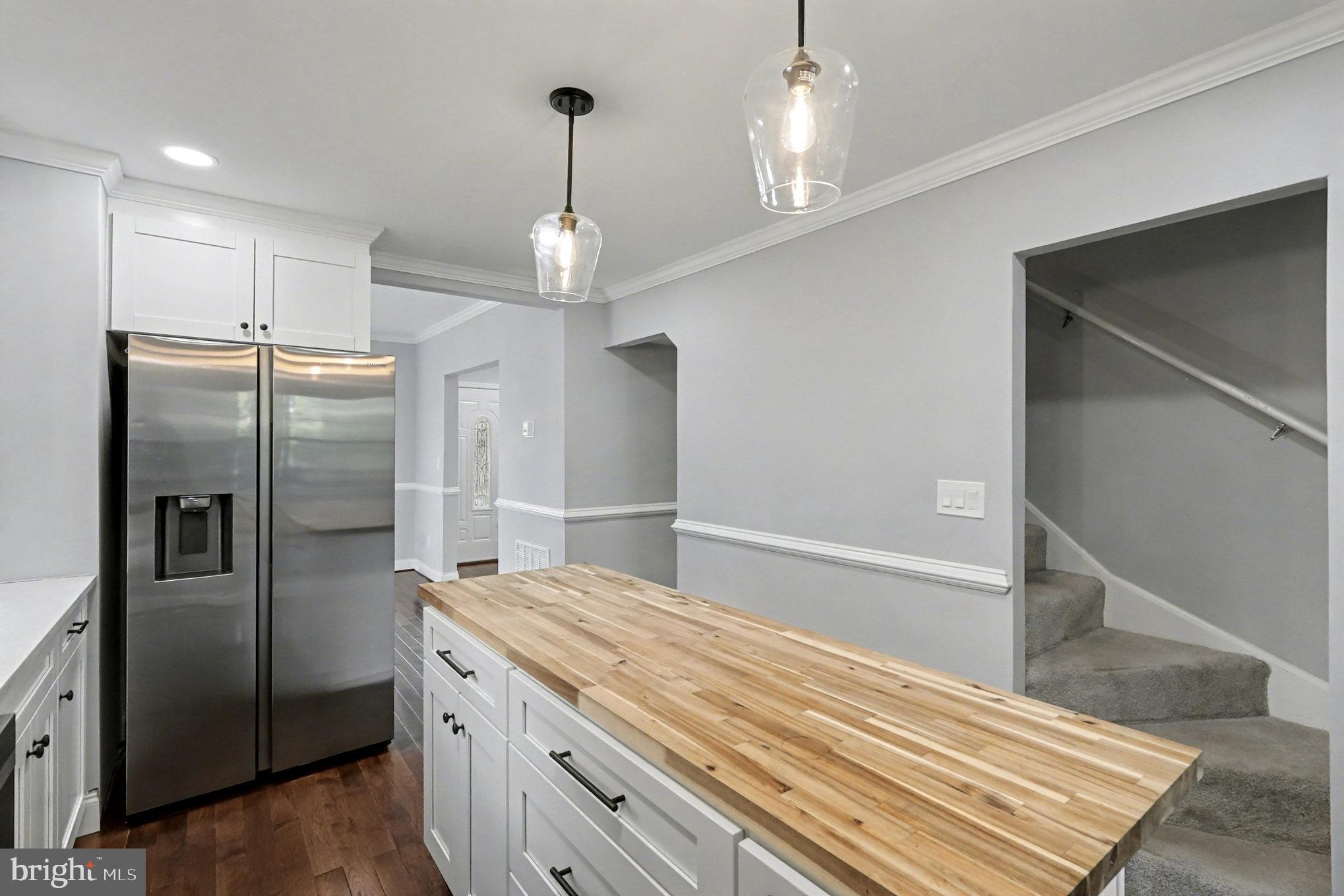 5406 Taylor Road Hyattsville, MD 20781 - Photo 7 of 26 a bathroom with a refrigerator and a sink