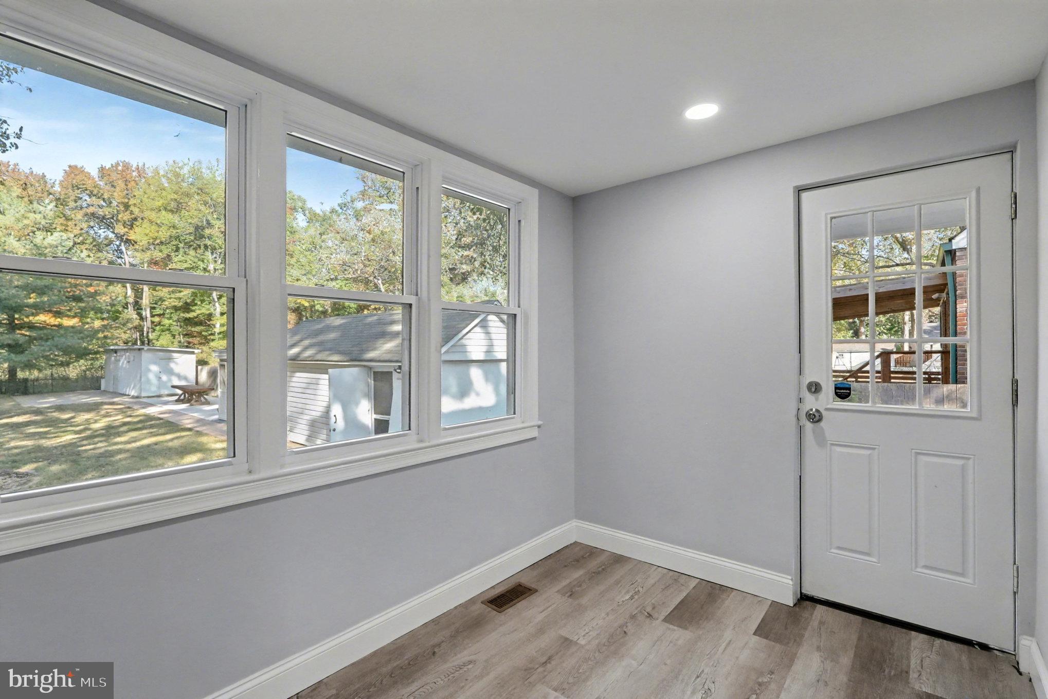 5406 Taylor Road Hyattsville, MD 20781 - Photo 9 of 26 a view of empty room with wooden floor and fan