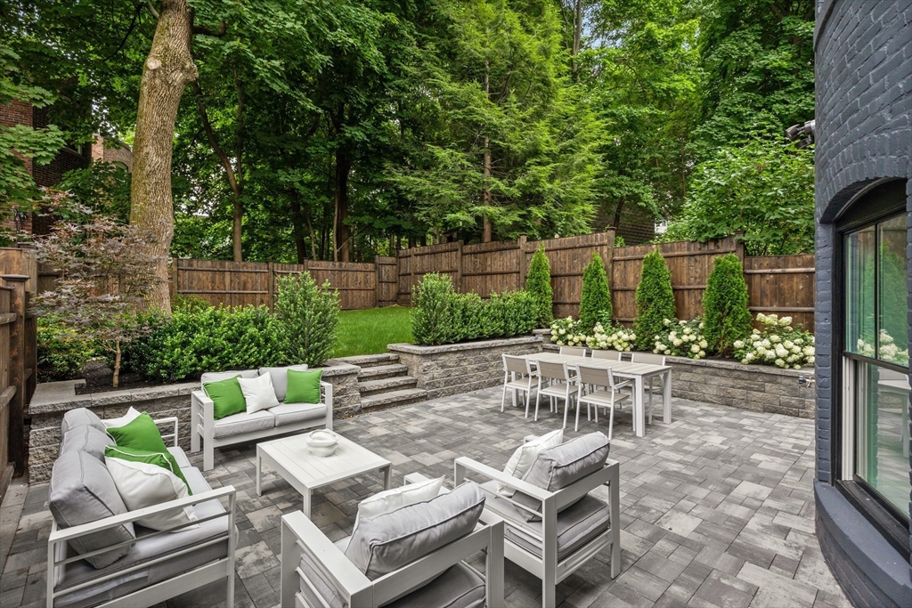 6 Claflin Road, Unit 2 Brookline, MA 02445 - Photo 1 of 39 a view of backyard with outdoor seating and trees